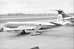 5Y-AAA (ex VP-KRL) in the immediate post-independence scheme after being re-registered. Note the 4 flags on the tail, just below the lion. As well as Kenya, Uganda and Tanganyika, this would include Zanzibar before its union with Tanganyika to form Tanzania in 1964    Parked at the then new London Heathrow Terminal 3, as you can see aircraft were parked either nose in or nose out from the Terminal. Dated 9th May 1964.    photo by Ian MacFarlane