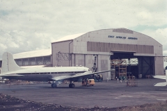 Front of hangar (1974) ( note the cut-out for SVC10 tail). In foreground is ex-British United DC4 (G-AOXK) by now Williamson Diamond Mines 5H-AAH of Tanzania